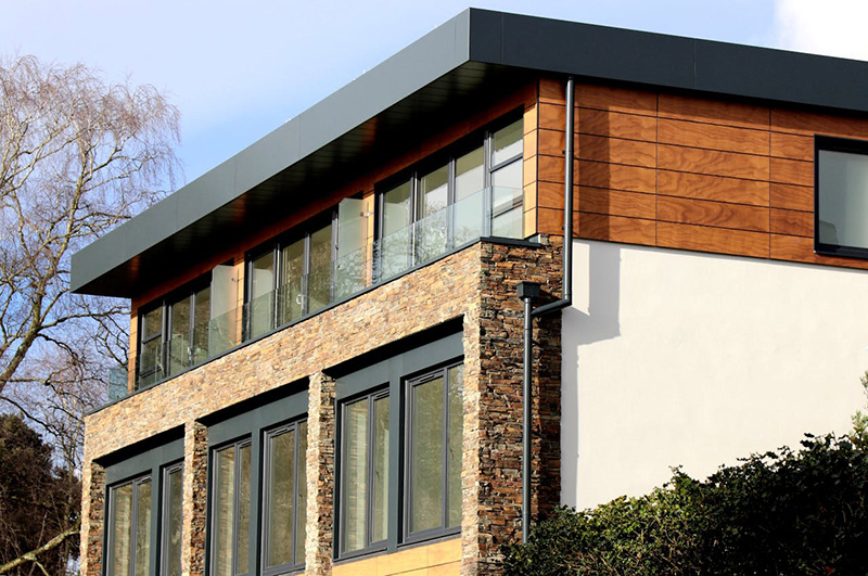 Closeup exterior view of a house window highlighting frame, glass, and structural components