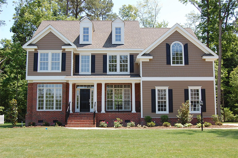 Exterior view of a modern vinyl window installed in a residential house