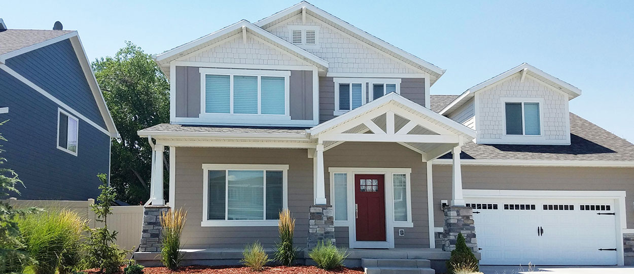 Exterior view of a modern vinyl house window installed in a Canadian residential home